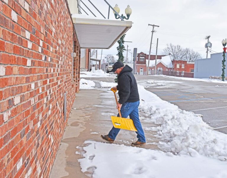 cop scoops snow crop