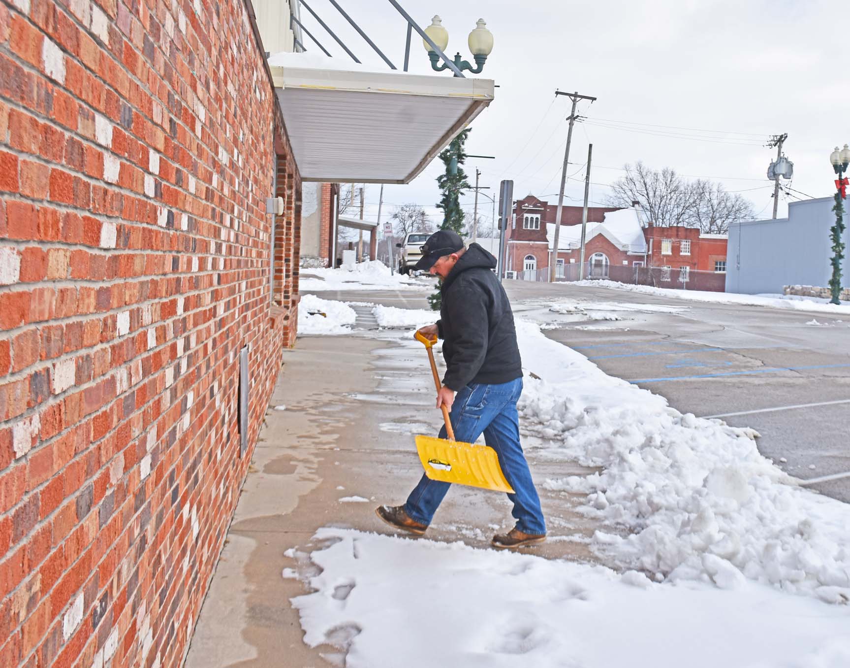 cop scoops snow crop