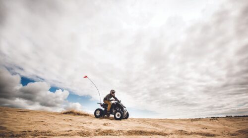 Man riding all-terrain vehicle.